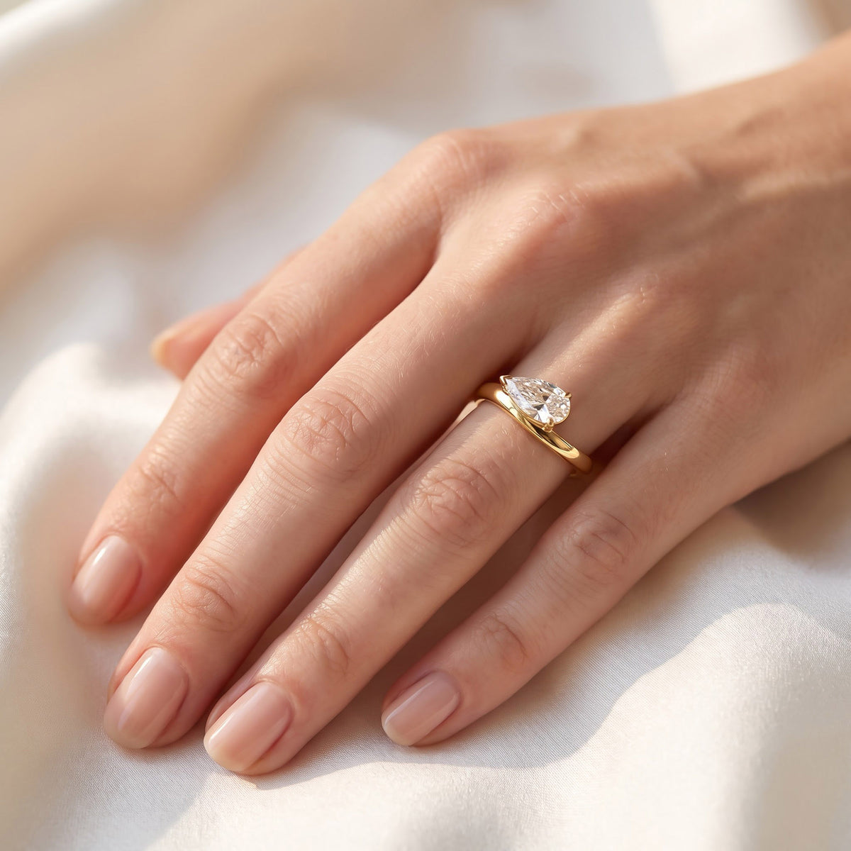 1.15 Carat Pear Shape Lab Grown Diamond Swirl Solitaire Ring