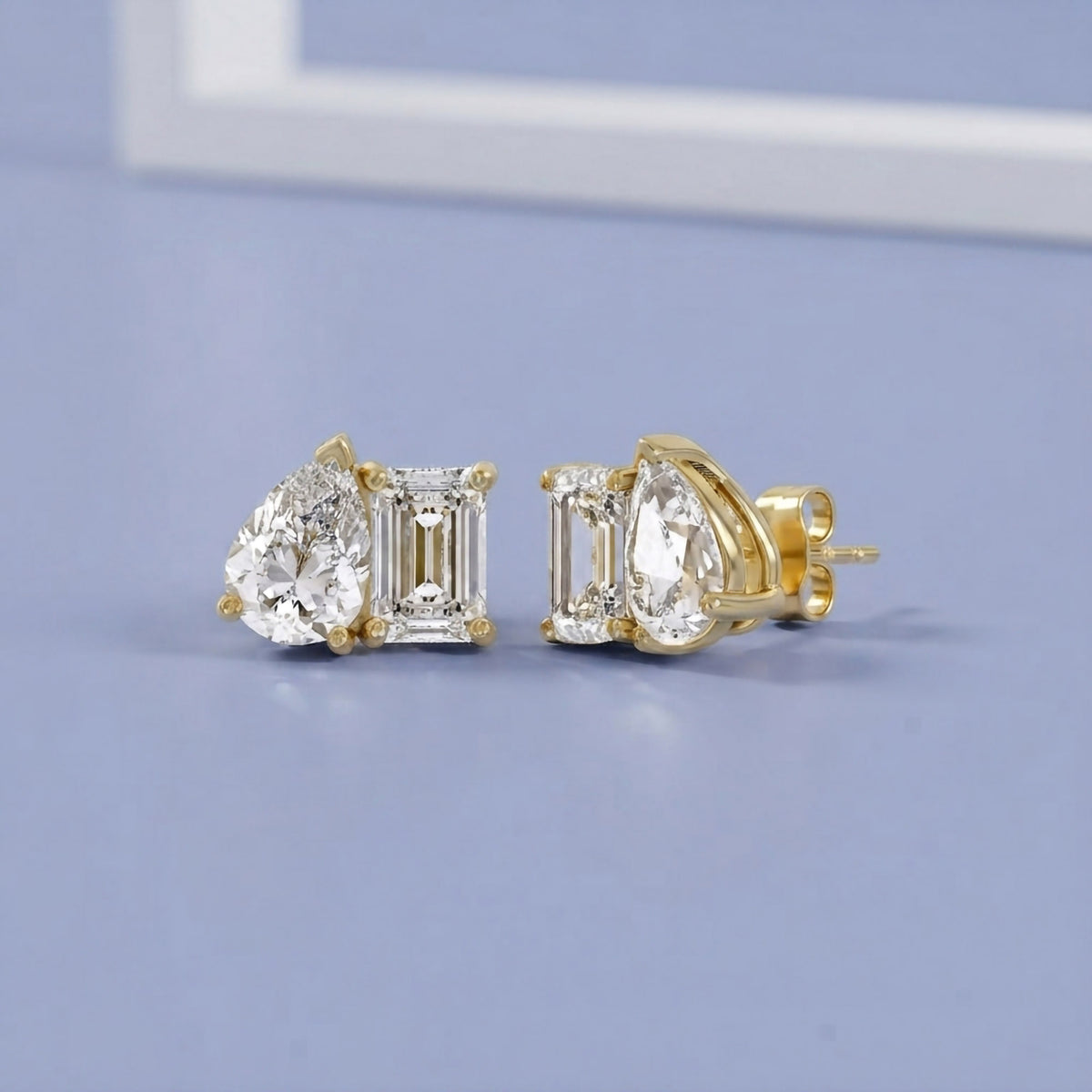 2.77 Carat Emerald and Pear Shape Lab Grown Diamond Toi et Moi Stud Earrings